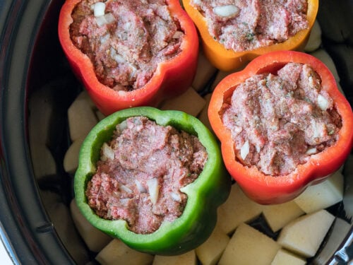 Everything cooks together in this Slow Cooker Meatloaf Stuffed Peppers with Mashed Potatoes! So genius!