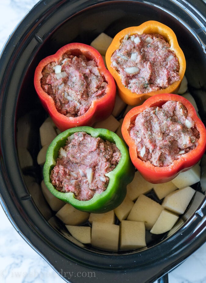 Everything cooks together in this Slow Cooker Meatloaf Stuffed Peppers with Mashed Potatoes! So genius!