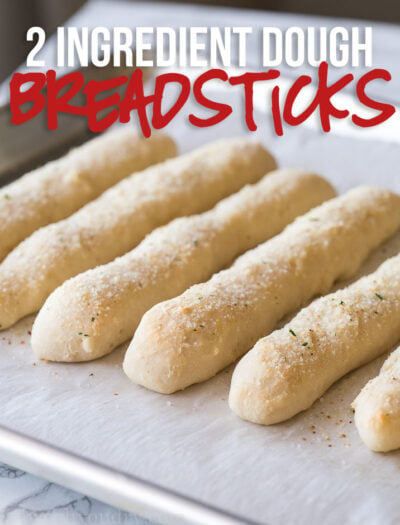 These 2 ingredient dough Garlic Breadsticks are just 1 weight watcher freestyle point each! So easy to make and seriously SO GOOD!