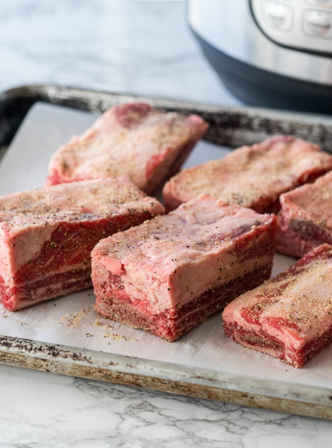 Give the beef short ribs a quick rub down with some simple seasonings and then pop them in the pressure cooker for an ultra easy and flavorful dinner!