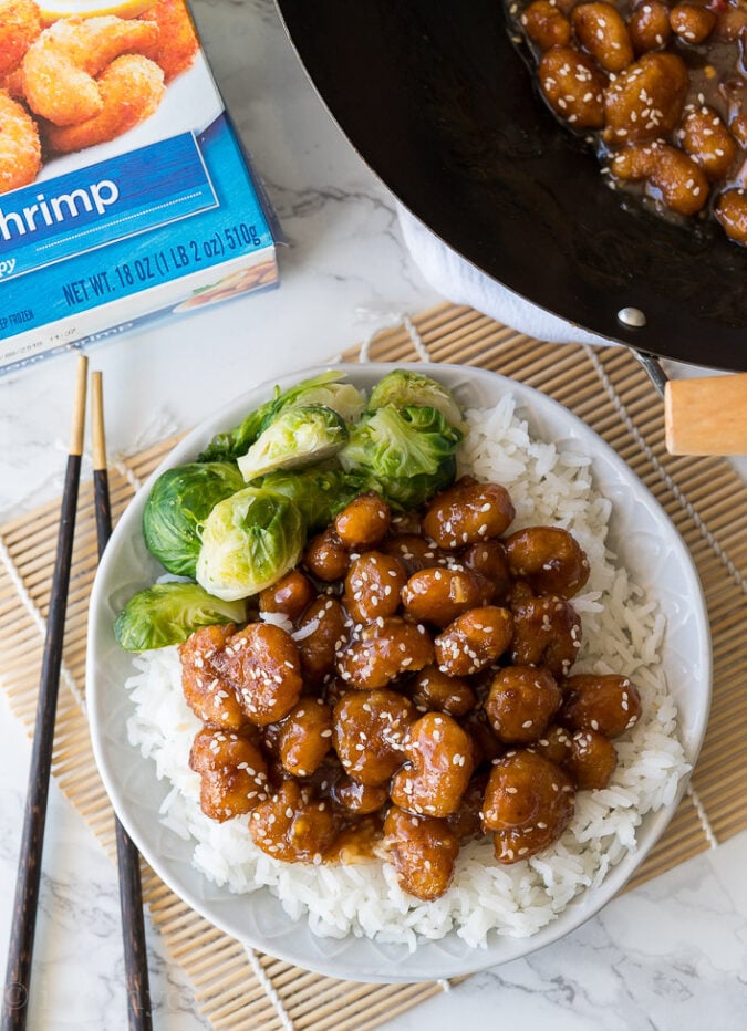 WOW! This Crispy Sesame Popcorn Shrimp is ready in less than 30 minutes thanks to the ultra crispy popcorn shrimp! Just mix the sauce together and toss! Family dinner done right!