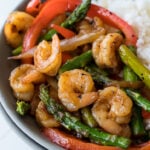 This quick and easy Honey Garlic Shrimp Stir Fry is filled with plump shrimp and fresh veggies in a simple and delicious honey garlic sauce!