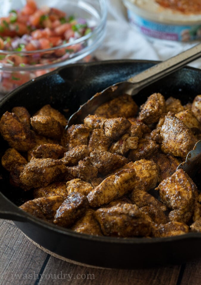 Brown the spicy chicken in a large cast iron skillet and use to top your bowl of rice and veggies!