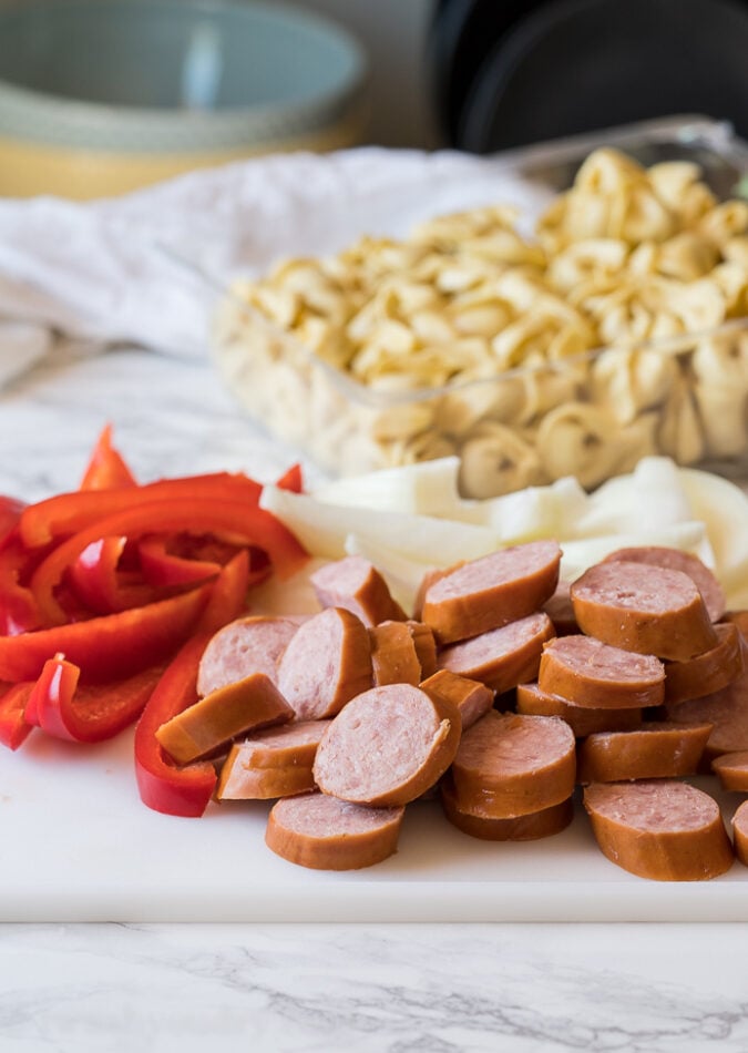 This easy weeknight dinner recipe starts with kielbasa sausage, red bell peppers, onions and refrigerated tortellini pasta.