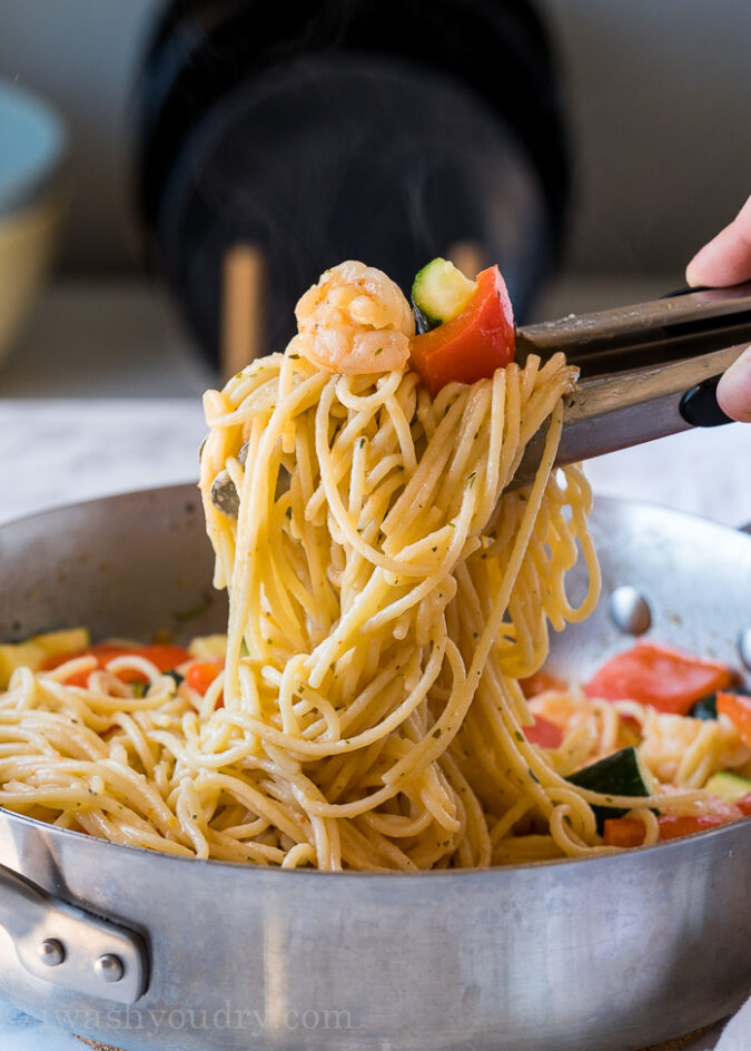 Toss in cooked pasta with the shrimp scampi, zucchini and bell peppers and dinner is ready!