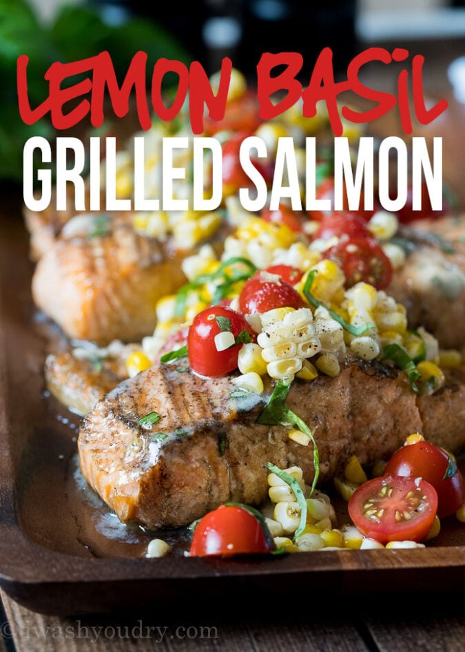 This Lemon Basil Grilled Salmon is topped with a lemon and basil infused butter and a grilled corn and tomato salad that's so fresh and delicious!