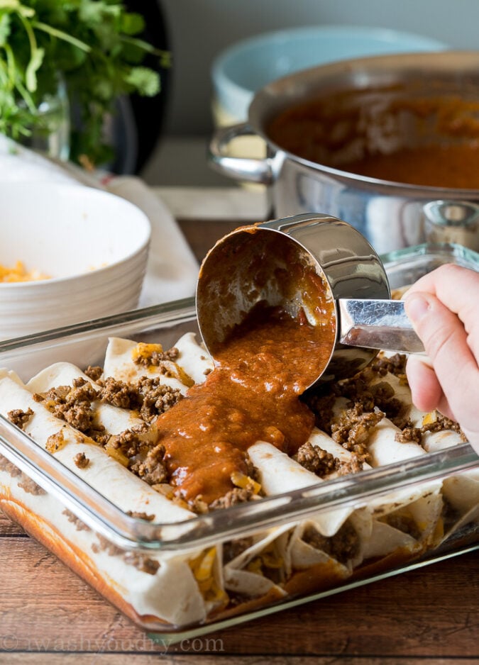 These Super Easy Ground Beef Enchiladas are filled with seasoned ground beef and melty cheese, then topped with all your favorite taco toppings!