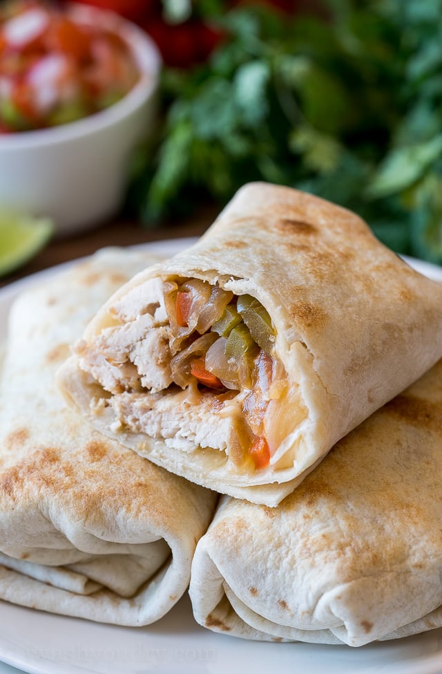 YUM! My kids LOVE these super easy Baked Chicken Fajita Burritos! It's all the goodness of fajitas wrapped up in a crisp tortilla!