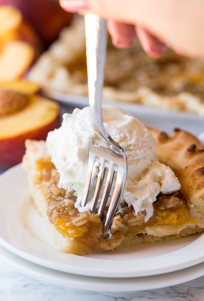 This Peach Slab Pie is filled with fresh peaches and topped with a crisp oat topping!