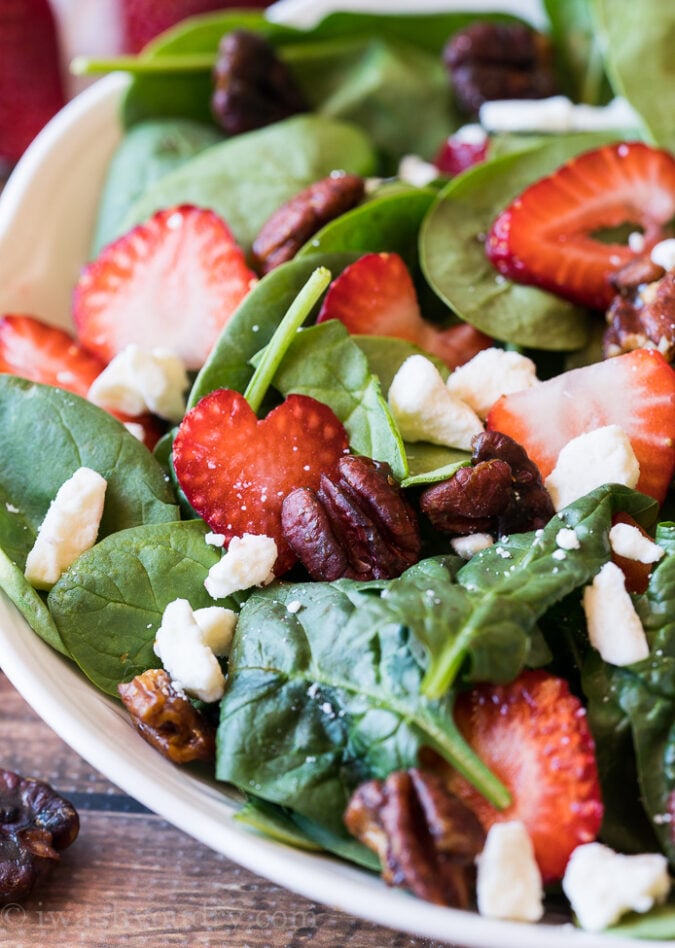 This super easy Strawberry Spinach Salad with candied pecans is the perfect summer salad! So quick and super delicious!