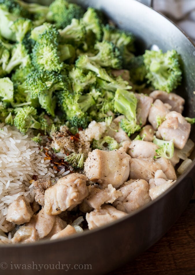 Start this super easy chicken skillet recipe by browning some chicken and onions. Then toss in some uncooked rice, broccoli and seasonings.
