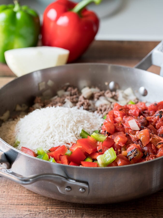 Brown hamburger in a skillet with some onion, garlic and then toss in diced bell peppers and tomatoes.