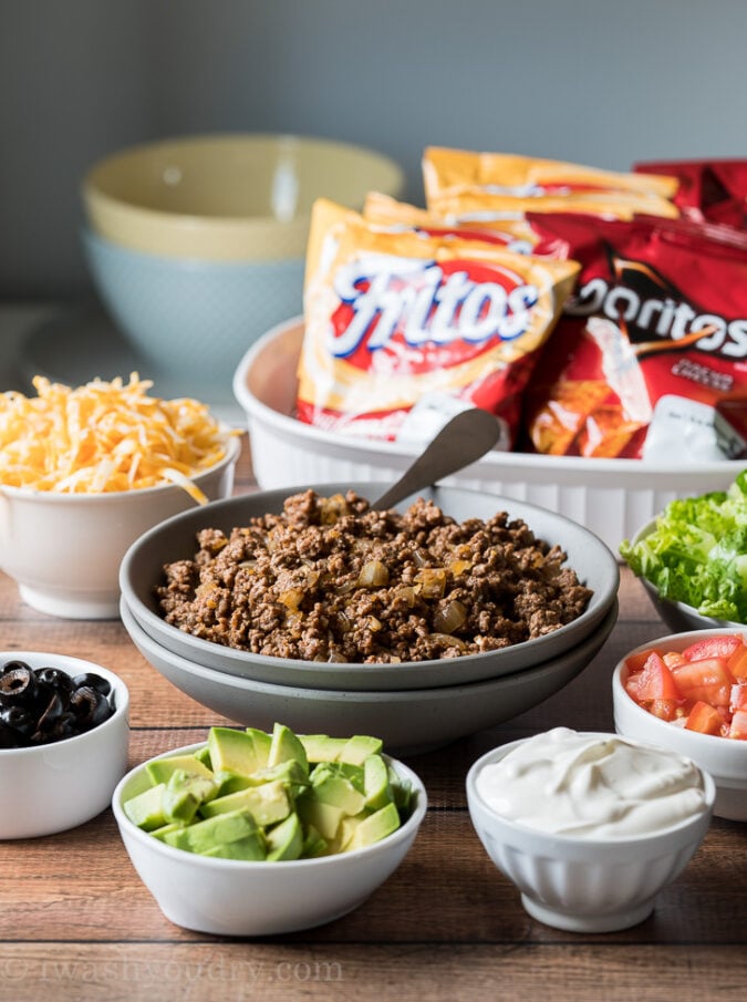 Lay out all the taco toppings, including ground taco meat with several bags of chips and let everyone assemble their own walking taco!
