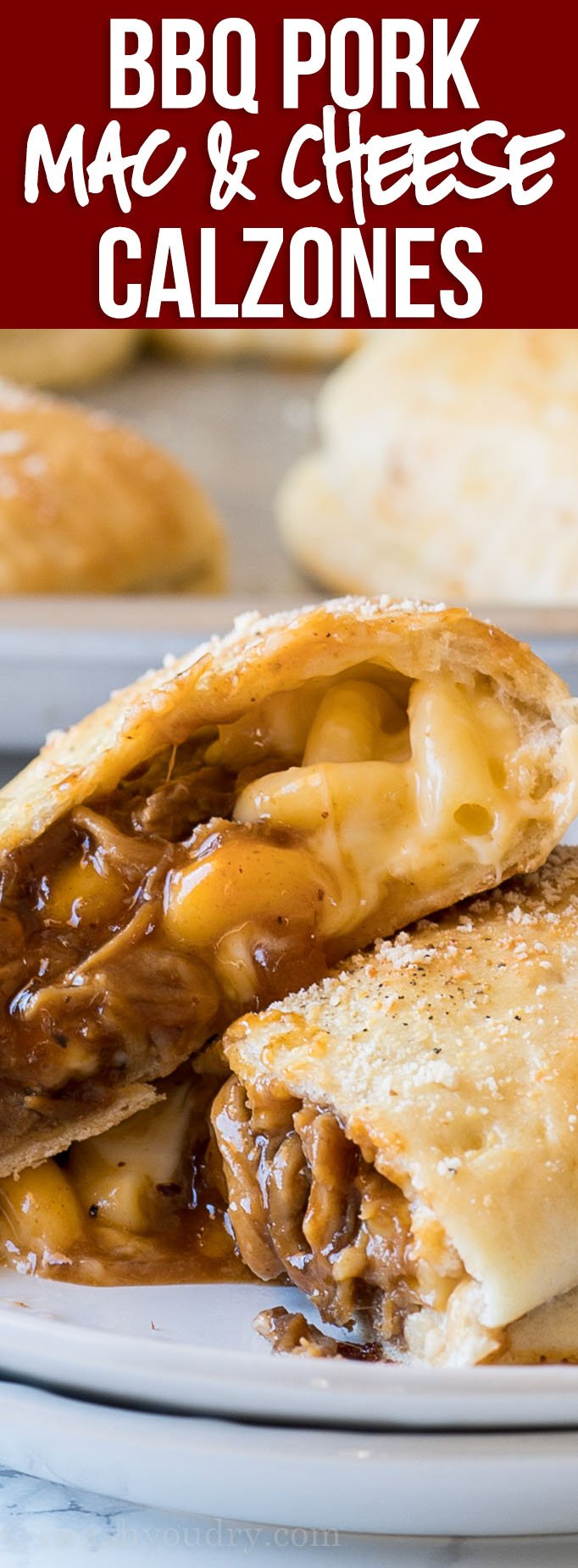YUM! These Cheesy BBQ Pork Calzones are stuffed with extra cheesy macaroni and cheese, saucy shredded pork and baked until golden brown.