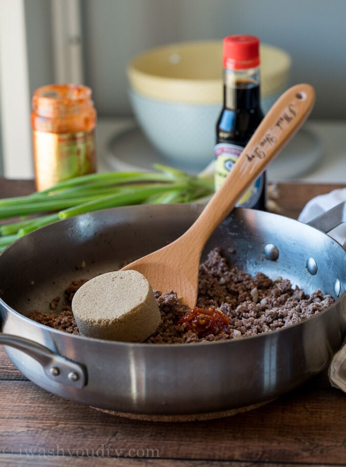 Start by browning your lean ground beef in a skillet with ginger and garlic. Drain any excess fat and then add in brown sugar, sesame oil, soy sauce and chili garlic sauce to create the BEST Korean Ground Beef!