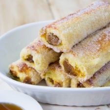 A close up of a stack of rolled Pumpkin French Toast