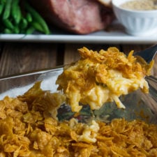 A pan filled with food, with cheesy potatoes
