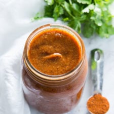 A glass jar of enchilada sauce