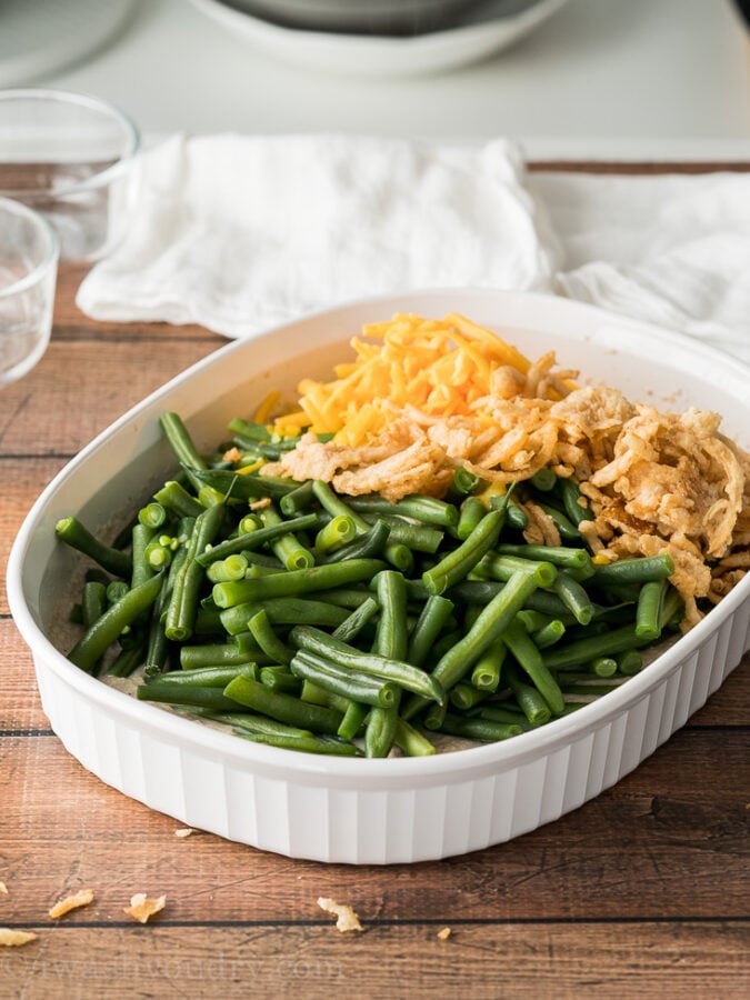 Whisk together the creamy base of your green bean casserole directly in your casserole dish, then stir in the green beans, onions and cheese!