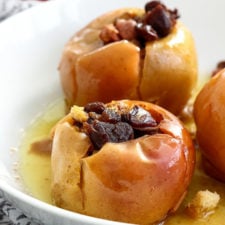 A bowl of food, with baked apples