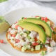shrimp served with avocado on top
