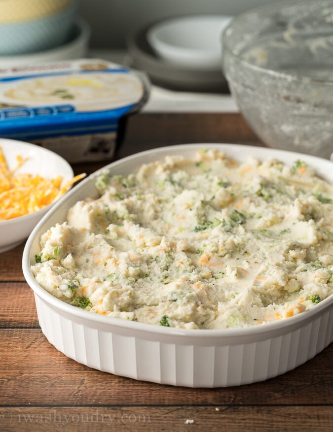 Spread the mashed potato mixture in a casserole dish and bake until heated in the middle.