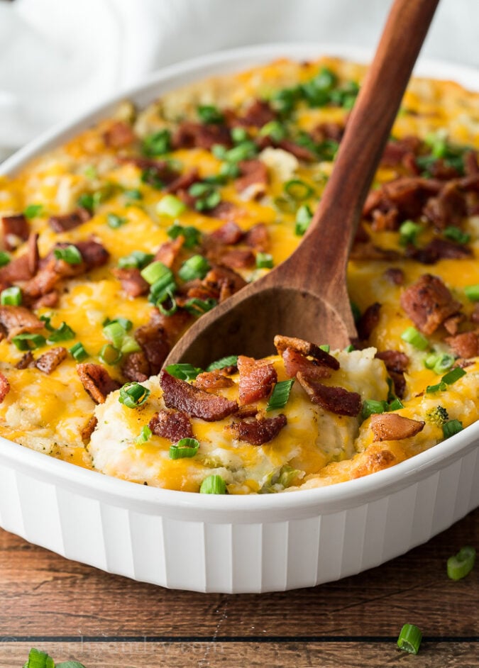 Top the mashed potato casserole with more cheese, crumbled bacon and green onions before baking again. Everyone will love this super easy side dish recipe!