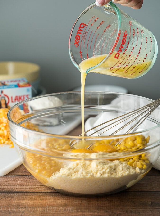 Pour the melted butter into the cornbread mix and corn.