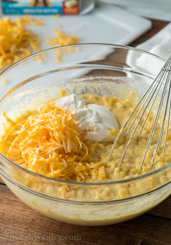 Gently fold in some sour cream and cheese into the corn pudding casserole mixture before baking.