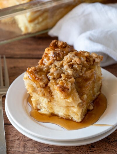YUM! This super easy French Toast Casserole recipe is soaked overnight in an egg mixture, topped with a brown sugar crumble, then baked to perfection!