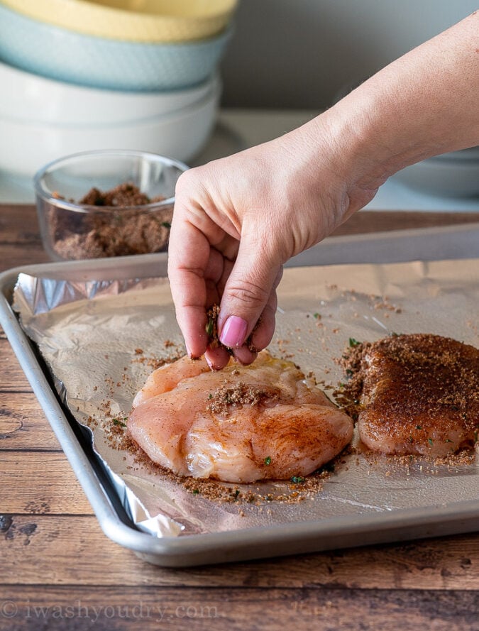 Season chicken breast with a simple blend of spices before baking.