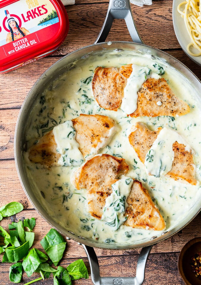 Creamy Garlic Chicken Recipe is filled with a creamy parmesan sauce, spinach and ready in less than 30 minutes!