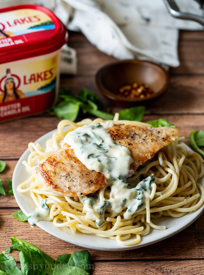 My family really LOVES this super easy chicken recipe! Creamy Garlic Parmesan Chicken with wilted spinach! YUM!