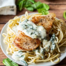 My family really LOVES this super easy chicken recipe! Creamy Garlic Parmesan Chicken with wilted spinach! YUM!