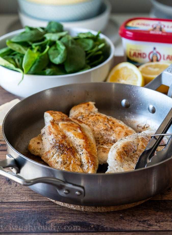 Sear the chicken breast on both sides to create a golden brown crust.