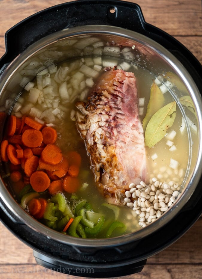 Fill the instant pot with all the ham and bean soup ingredients then let it come to pressure.