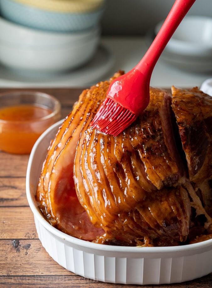 Reduce the apple cider and brown sugar to a glaze and brush all over the crockpot ham recipe.
