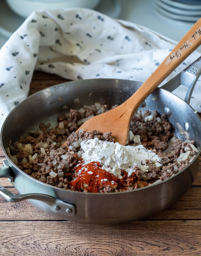 Brown the ground beef and then whisk in some flour and paprika until thickened.