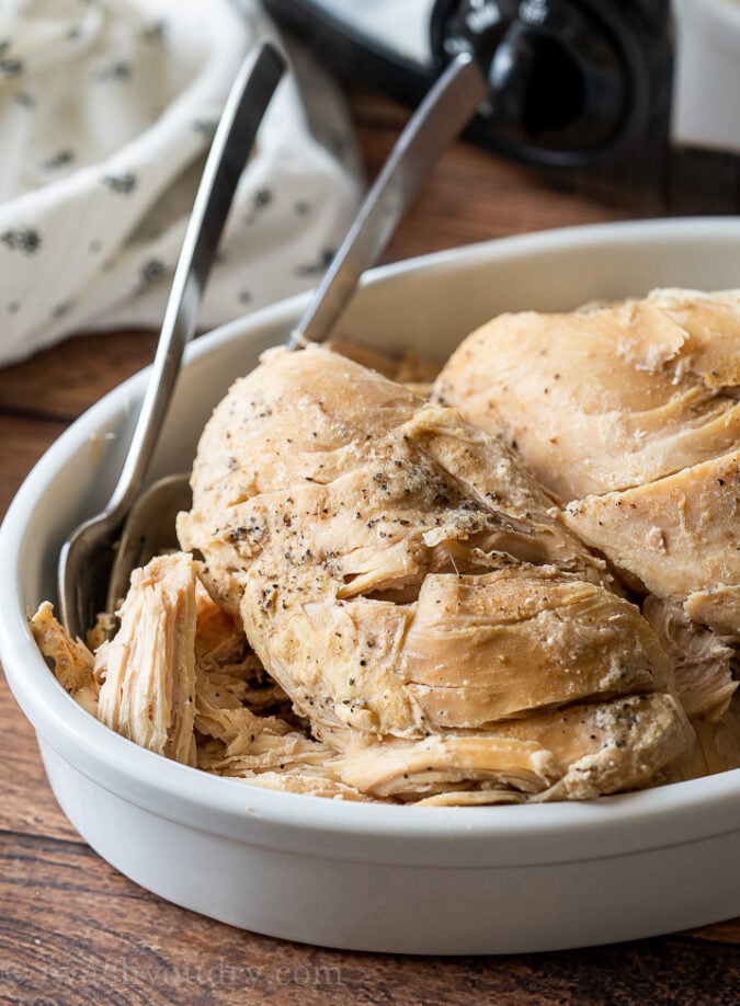 Ultra flavorful shredded chicken breast made easily in the SLOW COOKER! Perfect for meal prep and weeknight dinners!