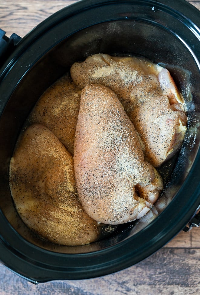 Make shredded chicken easily in the slow cooker by just tossing in chicken, chicken broth and a few simple seasonings!