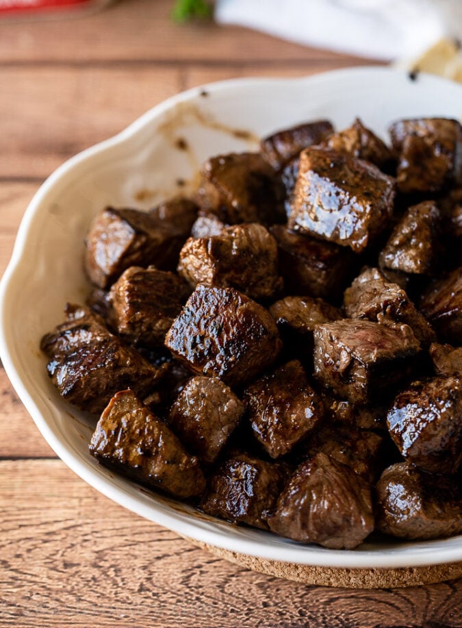 Brown tender pieces of steak in a hot skillet then remove to a plate to keep warm.