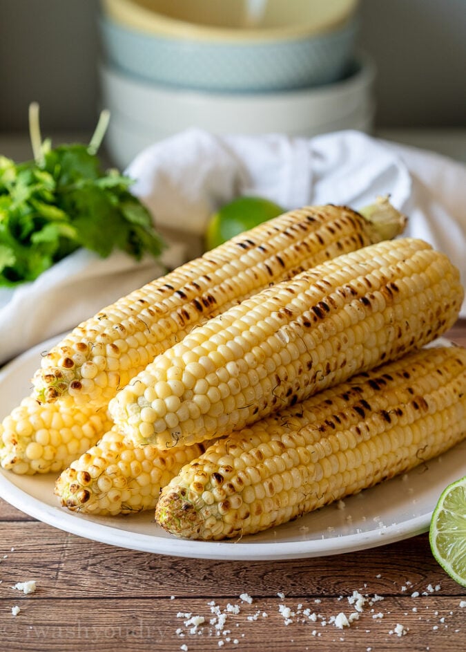 Grill the corn over high heat to slightly char it and then cut off the kernels into a bowl.