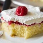 A piece of cake on a plate, with Raspberry