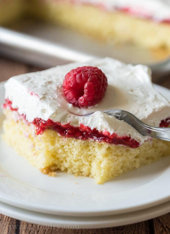 YUM! This Vanilla Raspberry Sheet Cake Recipe is super easy and the perfect summer potluck dessert recipe! 