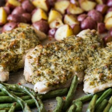 A whole dinner made in just ONE SHEET PAN! This Spinach Herb Baked Chicken Breast Recipe is combined with tender seasoned potatoes and fresh green beans. My whole family loved this one!