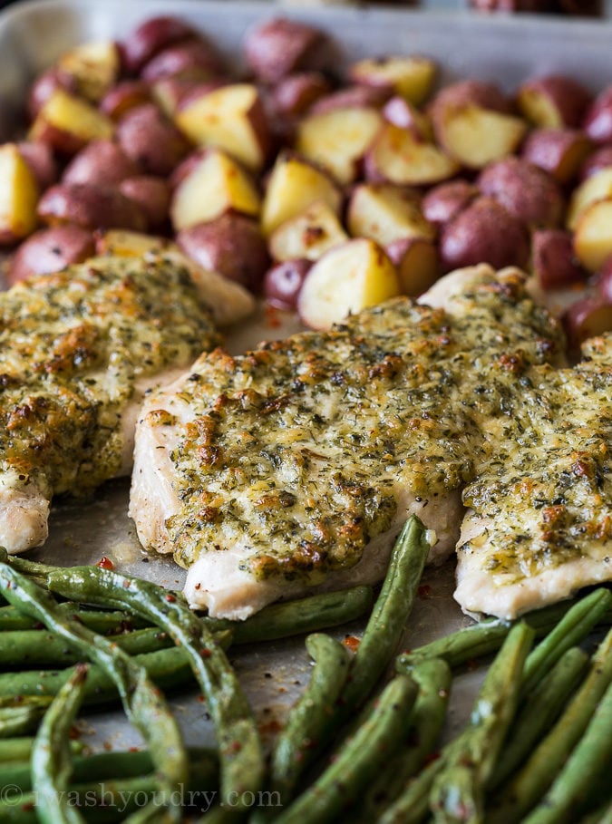 A whole dinner made in just ONE SHEET PAN! This Spinach Herb Baked Chicken Breast Recipe is combined with tender seasoned potatoes and fresh green beans. My whole family loved this one!
