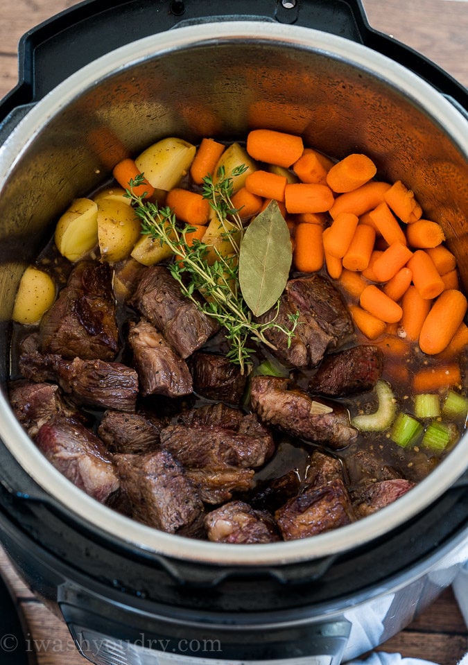 Combine the easy beef stew ingredients in the Instant Pot and cook on high pressure.
