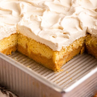 pumpkin magic cake in pan with frosting on top