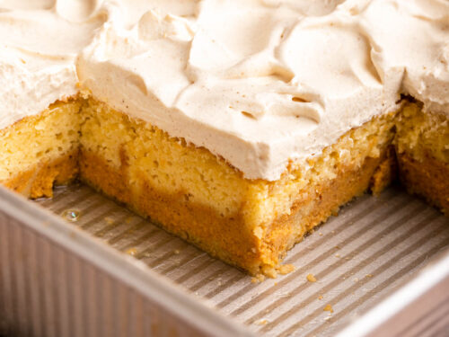 pumpkin magic cake in pan with frosting on top