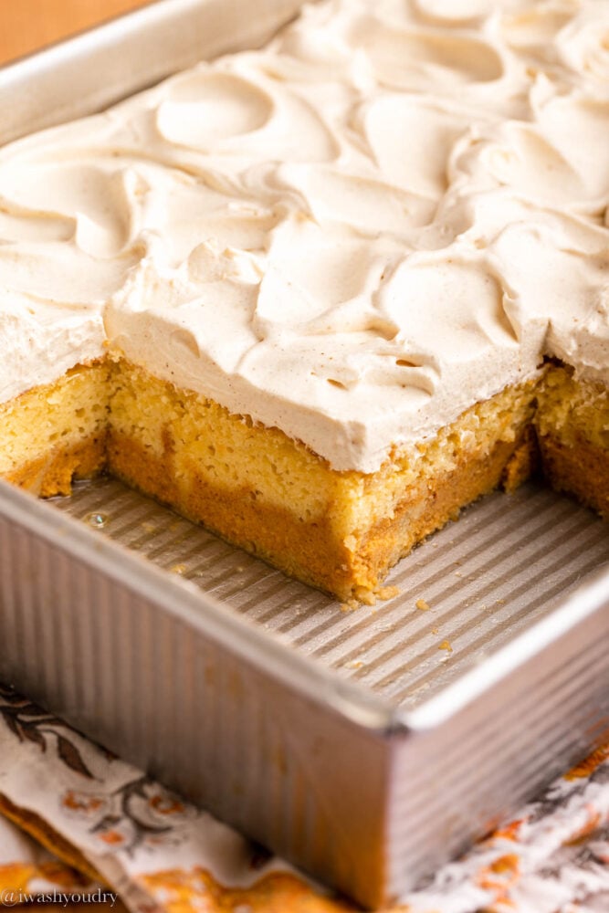 pumpkin magic cake in pan with frosting on top